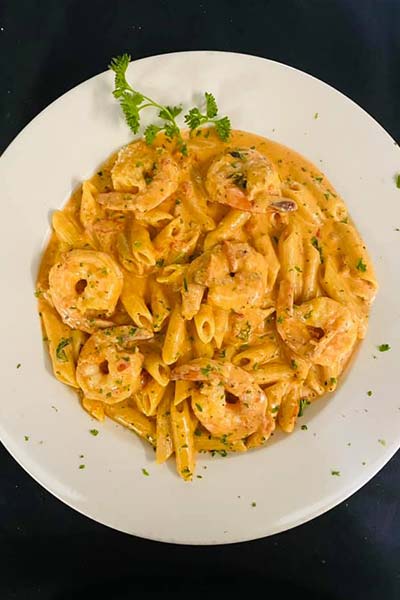 Creamy shrimp pasta with penne, served at Carini Italian Restaurant Bar in Richmond, Virginia.