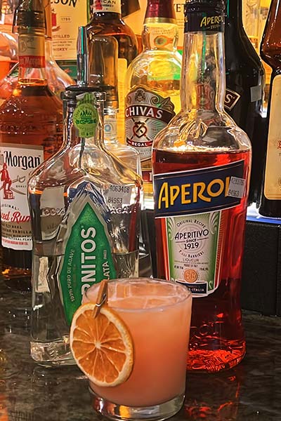 A cocktail with a dried orange slice at Carini Italian Restaurant Bar in Richmond, Virginia.