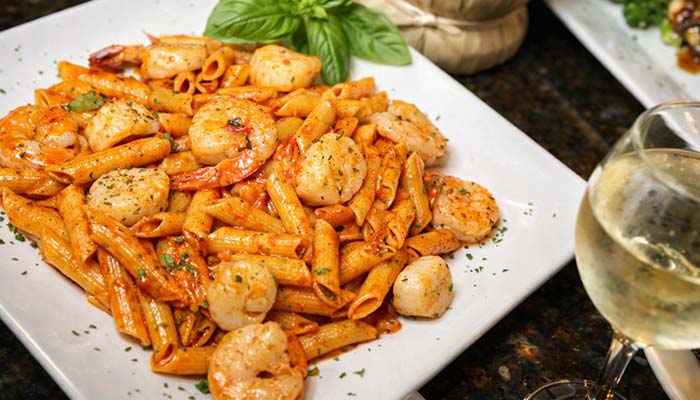 Penne pasta with shrimp in tomato sauce at Carini Italian Restaurant Bar, Richmond, Virginia.