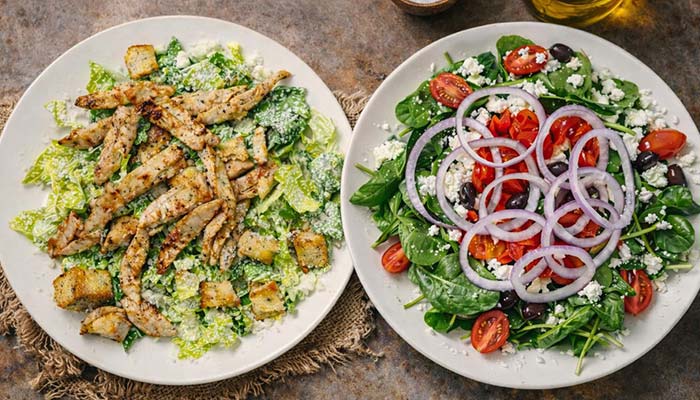A Caesar salad with grilled chicken from Carini Italian Restaurant Bar Richmond Virginia.